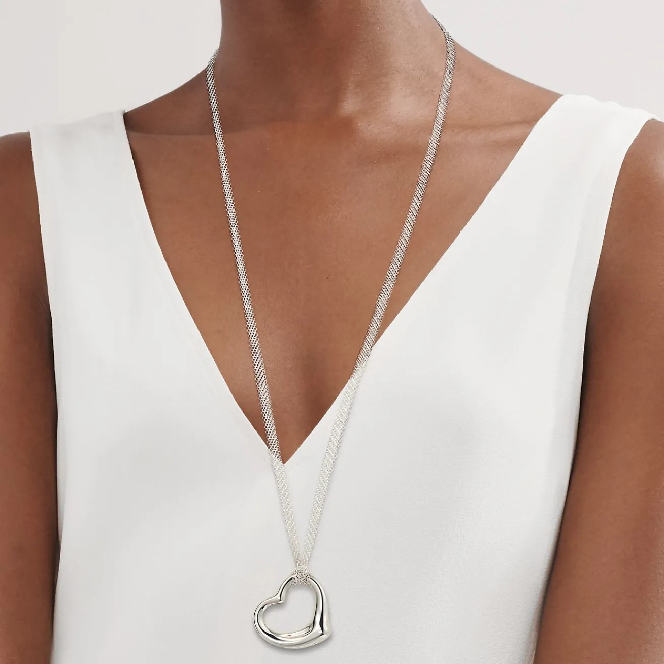 Tiffany & Co. Elsa Peretti® Open Heart pendant in sterling silver on a 30" mesh chain. | ^ Necklaces & Pendants|Bold Silver Jewelry