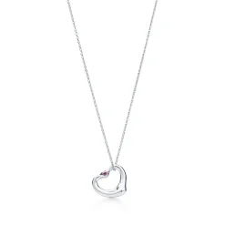 Tiffany & Co. Elsa Peretti® Open Heart pendant in sterling silver with a pink sapphire. | ^ Necklaces & Pendants|Sterling Silver Jewelry