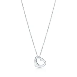Tiffany & Co. Elsa Peretti® Open Heart pendant in sterling silver with a pink sapphire. | ^ Necklaces & Pendants|Sterling Silver Jewelry