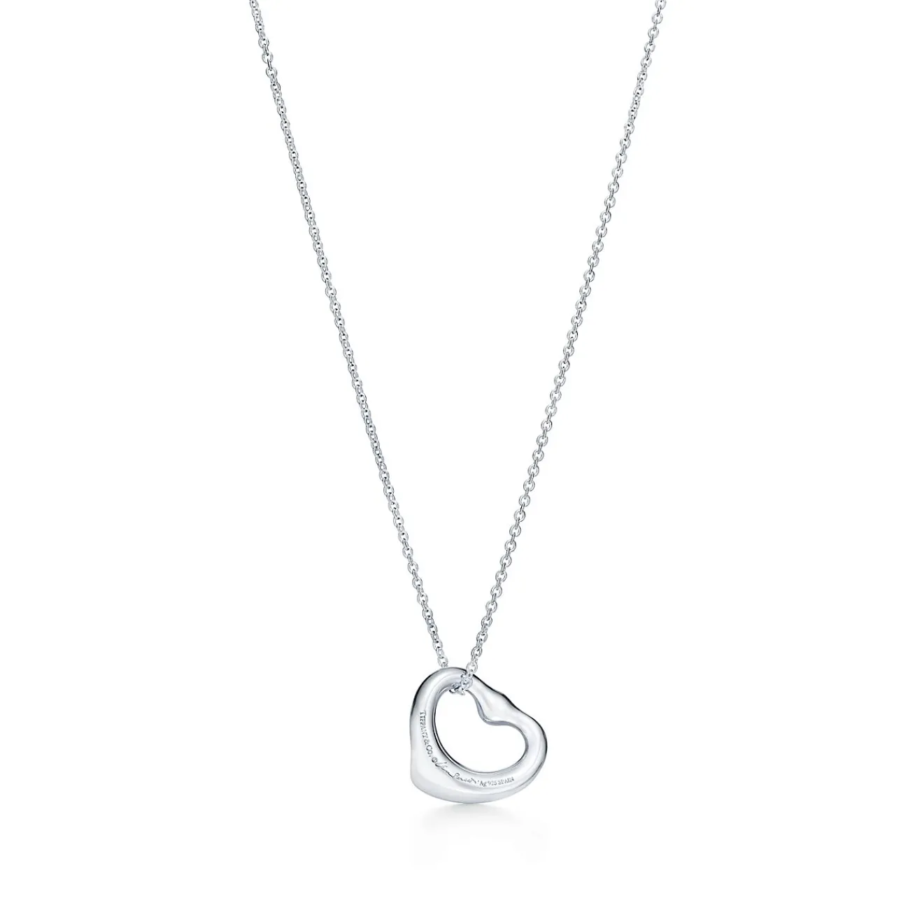 Tiffany & Co. Elsa Peretti® Open Heart pendant in sterling silver with a pink sapphire. | ^ Necklaces & Pendants|Sterling Silver Jewelry