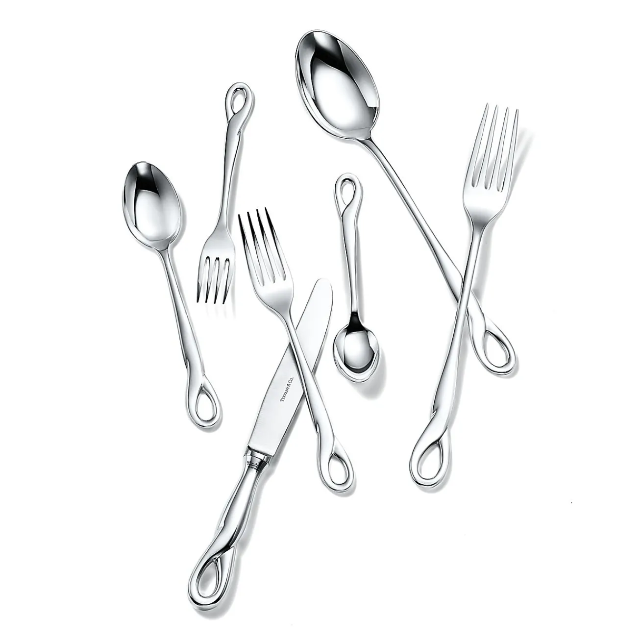Tiffany & Co. Elsa Peretti® Padova™ 32-piece flatware set in sterling silver. | ^ Elsa Peretti®|The Couple
