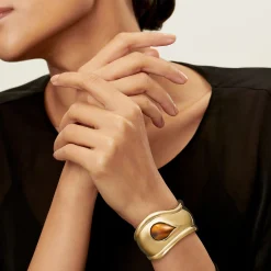 Tiffany & Co. Elsa Peretti® Small Bone Cuff in Yellow Gold with Tiger's Eye, 43 mm Wide | ^ Bracelets|Gold Jewelry