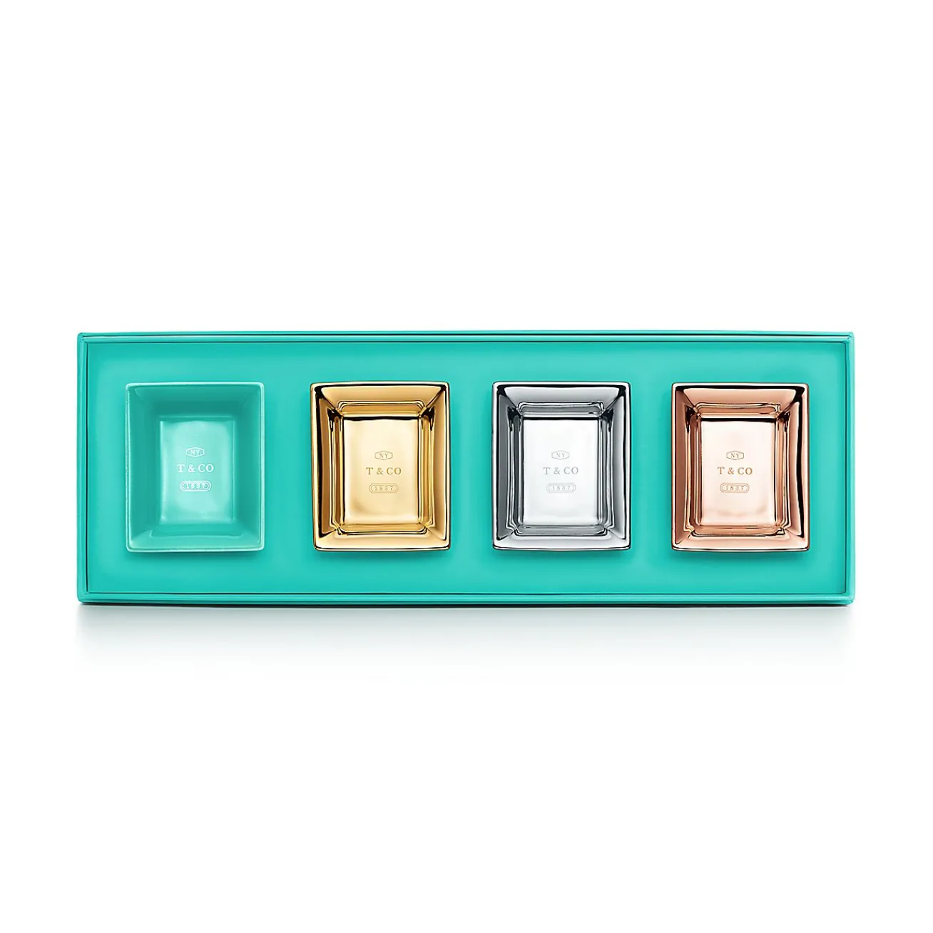 Tiffany & Co. Metallic vide poches in porcelain, set of four. | ^ The Home|Housewarming Gifts