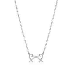 Tiffany & Co. Paloma Picasso® Double Loving Heart pendant in sterling silver with diamonds. | ^ Necklaces & Pendants|Sterling Silver Jewelry
