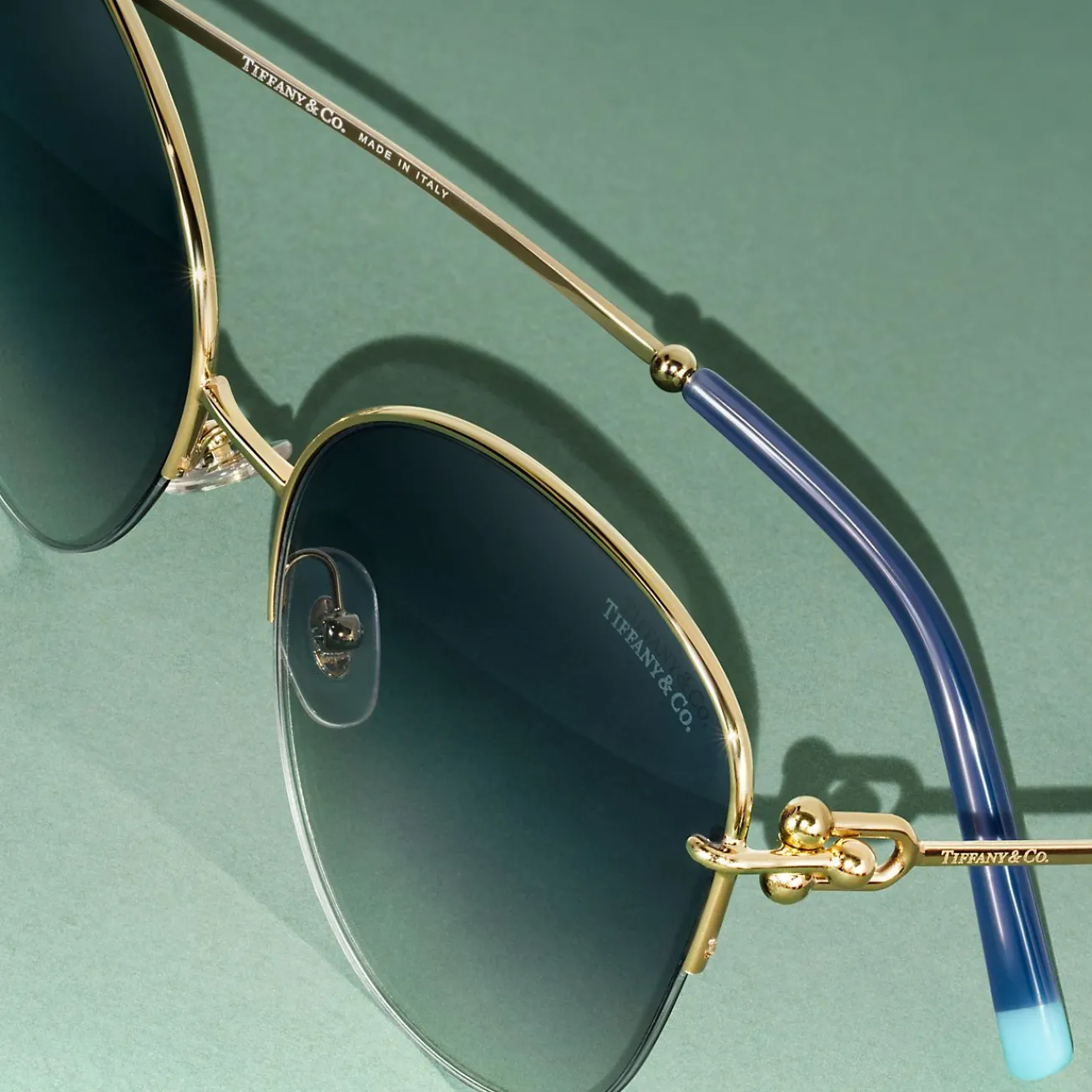 Tiffany & Co. Tiffany HardWear Sunglasses in Pale Gold-colored Metal with Blue Lenses | ^ Tiffany HardWear|Sunglasses