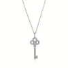Tiffany & Co. Tiffany Keys mini crown key pendant in 18k white gold with diamonds. | ^ Necklaces & Pendants|Diamond Jewelry