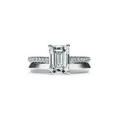 Tiffany & Co. Tiffany Novo® emerald-cut engagement ring with a pavé diamond band in platinum. | ^ Engagement Rings