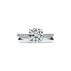 Tiffany & Co. Tiffany Novo® round brilliant engagement ring with a pavé diamond platinum band. | ^ Engagement Rings