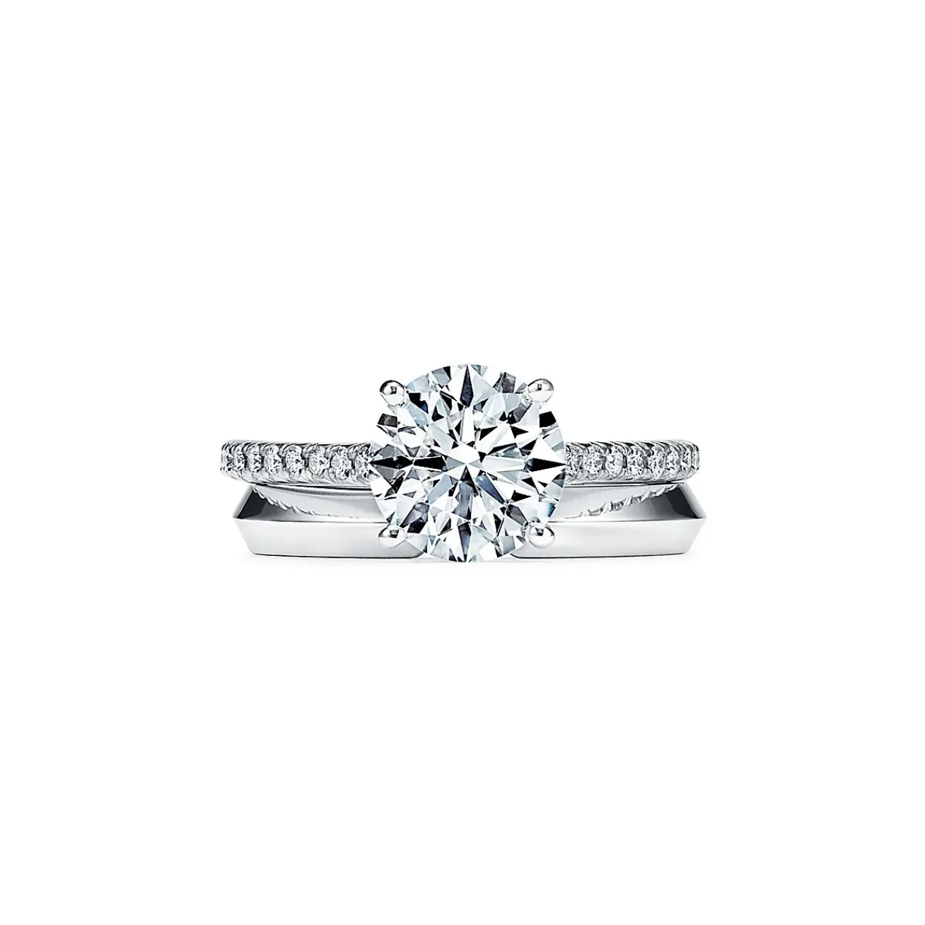 Tiffany & Co. Tiffany Novo® round brilliant engagement ring with a pavé diamond platinum band. | ^ Engagement Rings