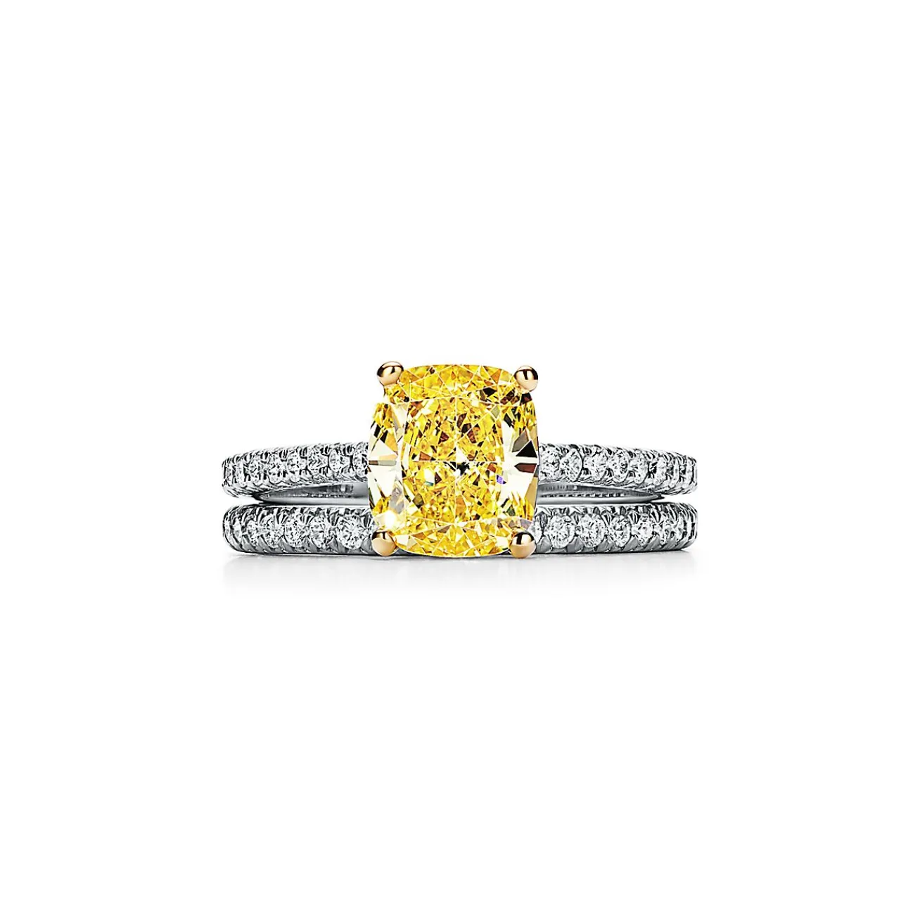 Tiffany & Co. Tiffany Novo® yellow diamond engagement ring with a pavé diamond platinum band. | ^ Engagement Rings