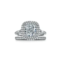 Tiffany & Co. Tiffany Soleste® cushion-cut engagement ring with a diamond band in platinum. | ^ Engagement Rings