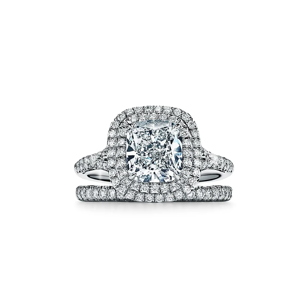 Tiffany & Co. Tiffany Soleste® cushion-cut engagement ring with a diamond band in platinum. | ^ Engagement Rings