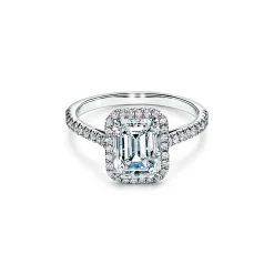 Tiffany & Co. Tiffany Soleste® emerald-cut halo engagement ring with a diamond platinum band. | ^ Engagement Rings