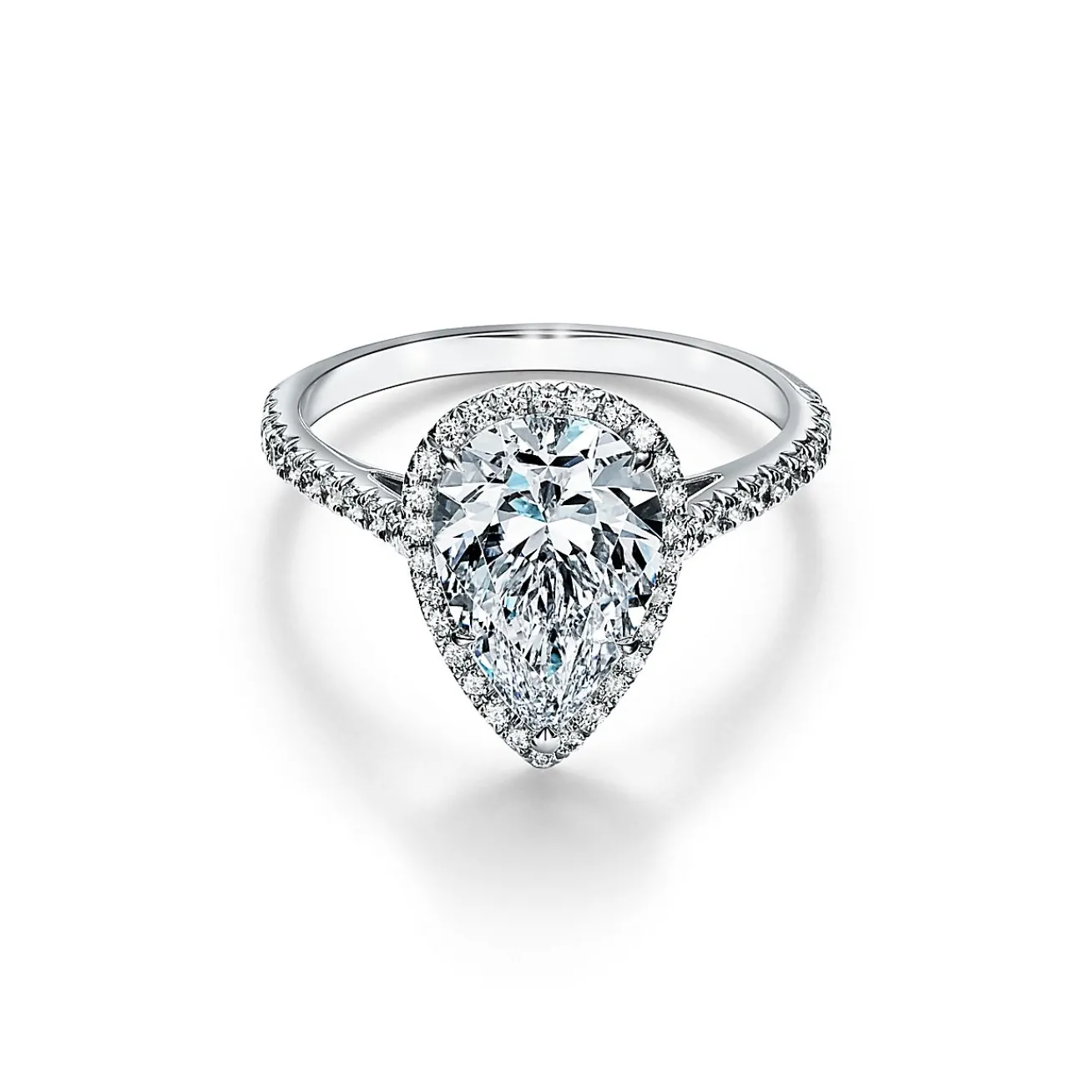 Tiffany & Co. Tiffany Soleste® pear-shaped halo engagement ring with a diamond platinum band. | ^ Engagement Rings