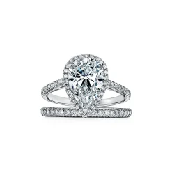 Tiffany & Co. Tiffany Soleste® pear-shaped halo engagement ring with a diamond platinum band. | ^ Engagement Rings