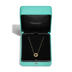 Tiffany & Co. Tiffany T diamond and black onyx circle pendant in 18k gold, small. | ^ Necklaces & Pendants|Men's Jewelry