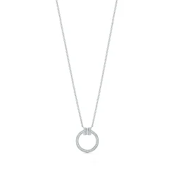 Tiffany & Co. Tiffany T diamond pendant in 18k white gold with a baguette diamond. | ^ Necklaces & Pendants|Diamond Jewelry