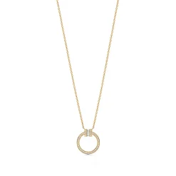 Tiffany & Co. Tiffany T diamond pendant in 18k gold with a baguette diamond. | ^ Necklaces & Pendants|Gold Jewelry