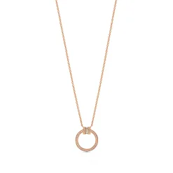 Tiffany & Co. Tiffany T diamond pendant in 18k rose gold with a baguette diamond. | ^ Necklaces & Pendants|Rose Gold Jewelry