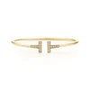 Tiffany & Co. Tiffany T diamond wire bracelet in 18k gold, medium. | ^ Bracelets|Men's Jewelry