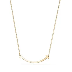 Tiffany & Co. Tiffany T medium smile pendant in 18k gold with diamonds. | ^ Necklaces & Pendants|Gold Jewelry