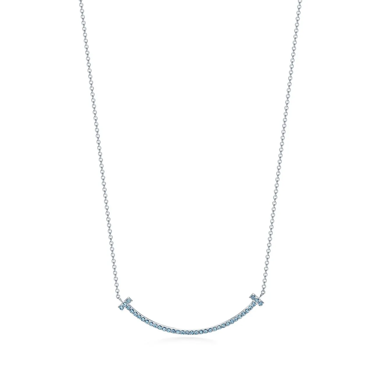 Tiffany & Co. Tiffany T smile pendant in 18k white gold with blue topazes, small. | ^ Necklaces & Pendants|Colored Gemstone Jewelry