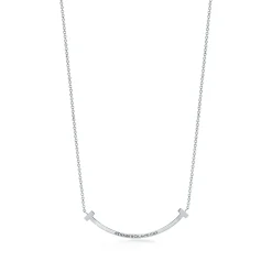 Tiffany & Co. Tiffany T smile pendant in 18k white gold with blue topazes, small. | ^ Necklaces & Pendants|Colored Gemstone Jewelry