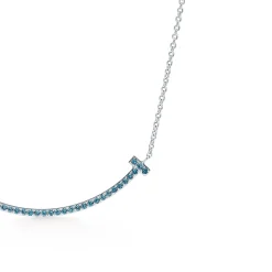 Tiffany & Co. Tiffany T smile pendant in 18k white gold with blue topazes, small. | ^ Necklaces & Pendants|Colored Gemstone Jewelry