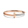 Tiffany & Co. Tiffany T T1 wide hinged bangle in 18k rose gold with baguette diamonds, large. | ^ Bracelets|Rose Gold Jewelry