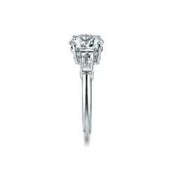 Tiffany & Co. Tiffany Three Stone engagement ring with baguette side stones in platinum. | ^ Engagement Rings