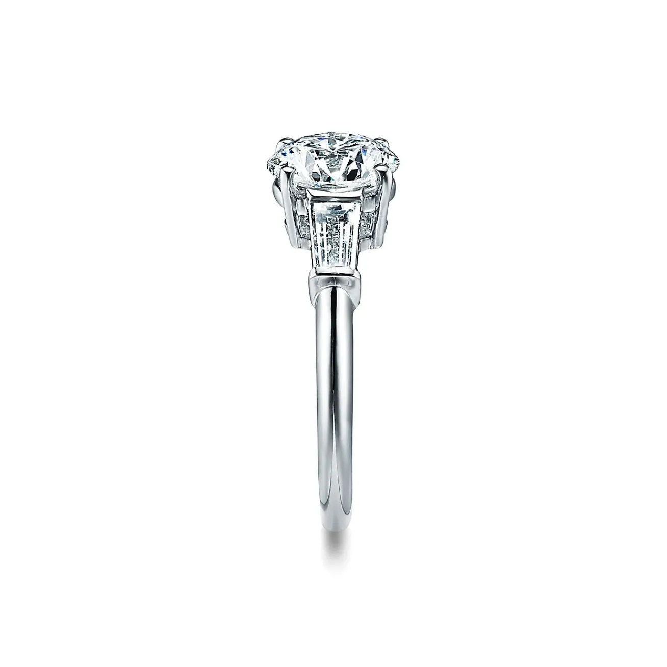 Tiffany & Co. Tiffany Three Stone engagement ring with baguette side stones in platinum. | ^ Engagement Rings
