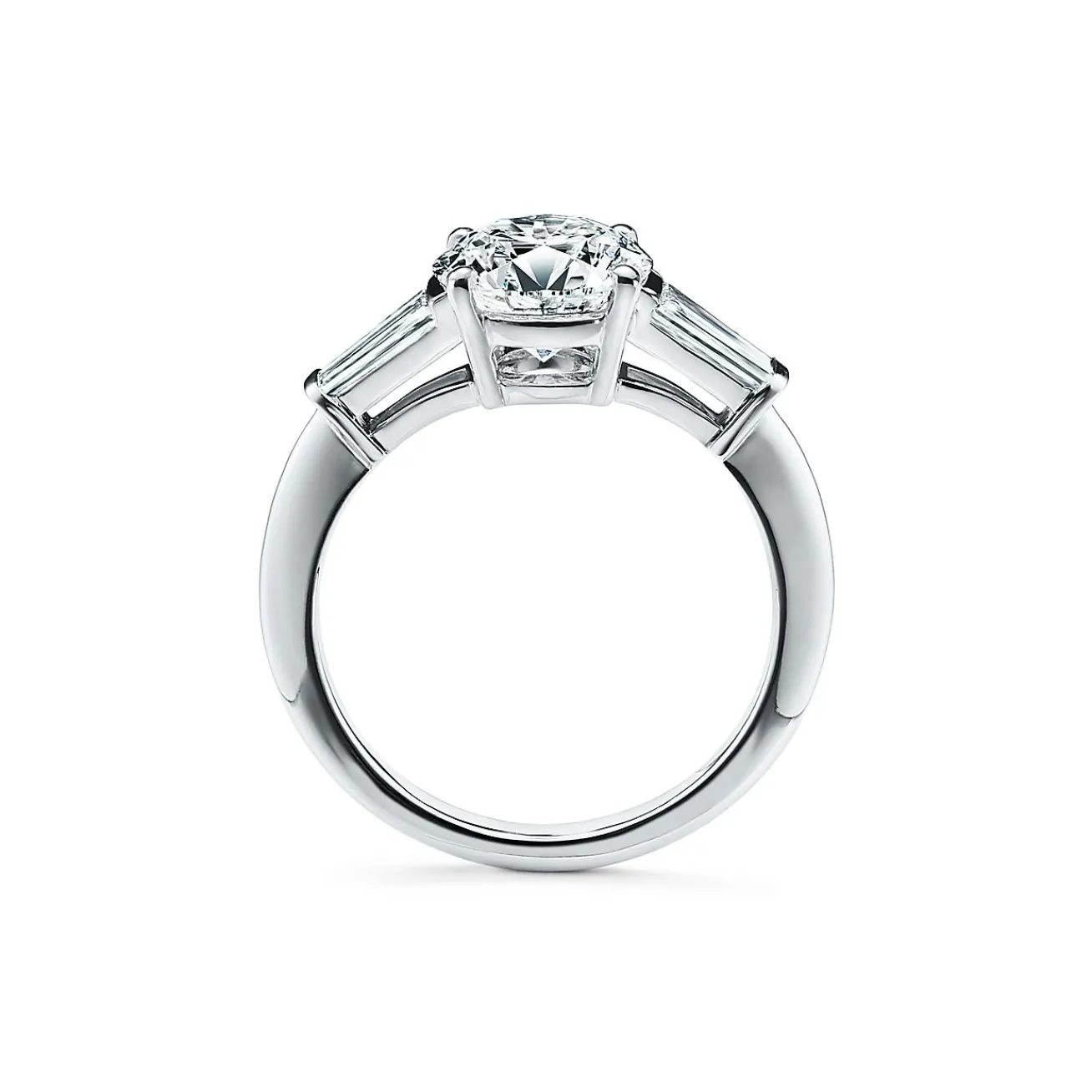 Tiffany & Co. Tiffany Three Stone engagement ring with baguette side stones in platinum. | ^ Engagement Rings