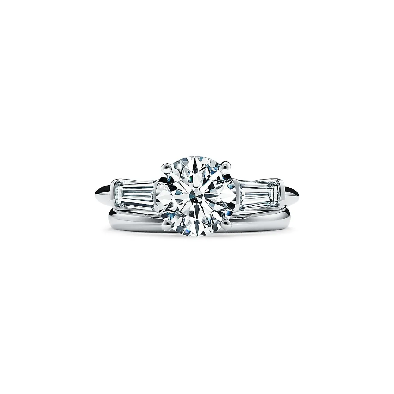 Tiffany & Co. Tiffany Three Stone engagement ring with baguette side stones in platinum. | ^ Engagement Rings