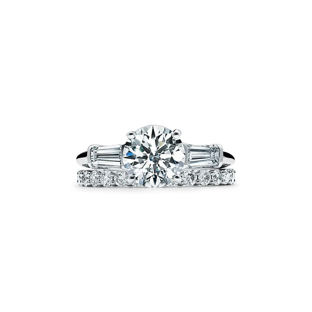 Tiffany & Co. Tiffany Three Stone engagement ring with baguette side stones in platinum. | ^ Engagement Rings