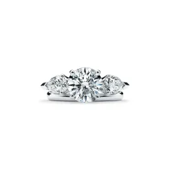 Tiffany & Co. Tiffany Three Stone engagement ring with pear-shaped side stones in platinum. | ^ Engagement Rings