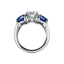 Tiffany & Co. Tiffany Three Stone engagement ring with sapphire side stones in platinum. | ^ Engagement Rings