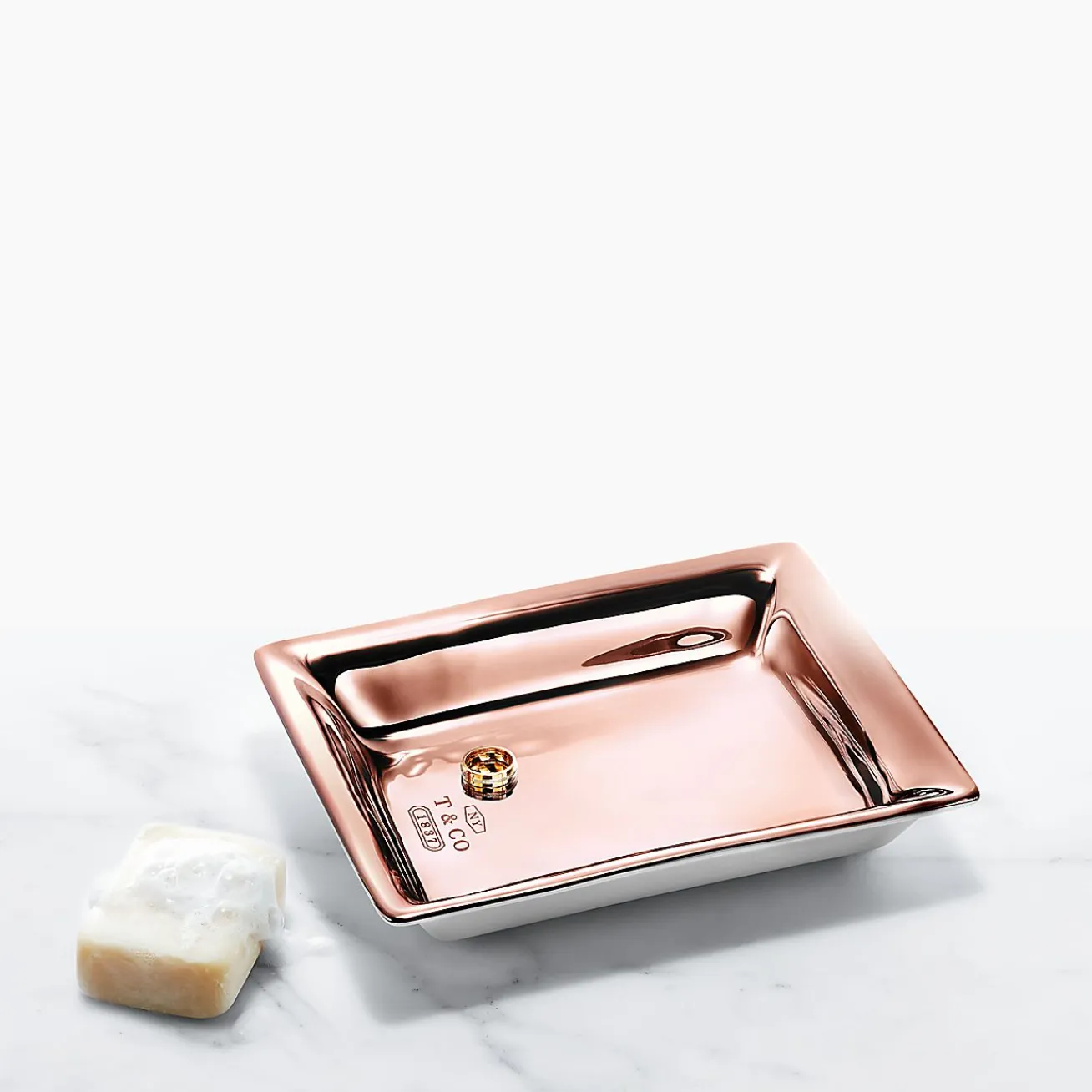 Tiffany & Co. Vide poche in porcelain with a rose gold hand-painted finish. | ^ The Home|Housewarming Gifts